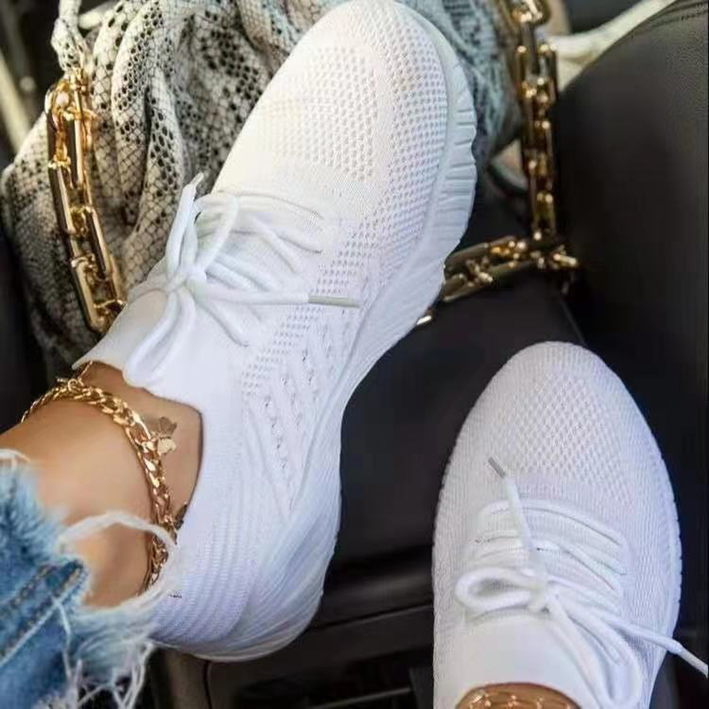 White sneakers with hot sale black heel